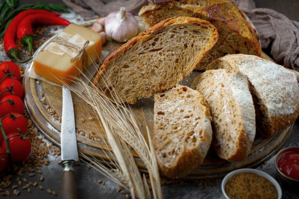 fresh-bread-old-background-with-kitchen-accessories-table